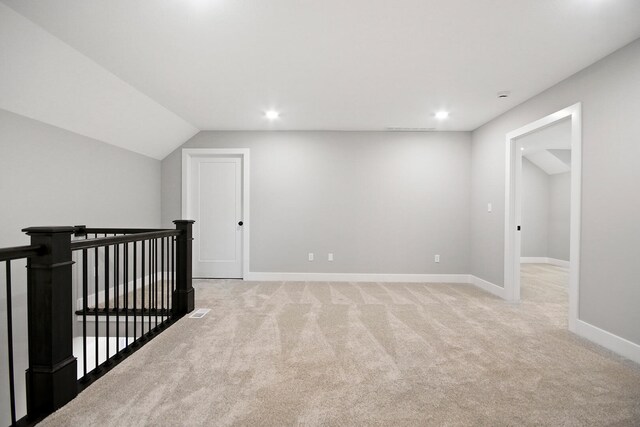6176 Partridge Ct, Columbia, MO 65202 - additional living space featuring light carpet, recessed lighting, and lofted ceiling