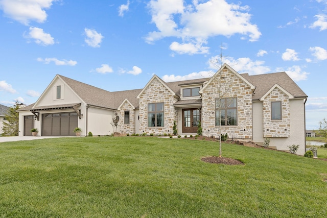 view of front of house with a garage, a front yard, concrete driveway, and stone siding