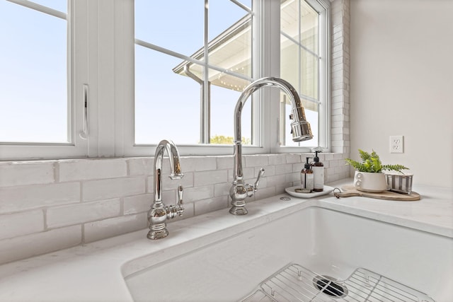 room details featuring a sink and backsplash