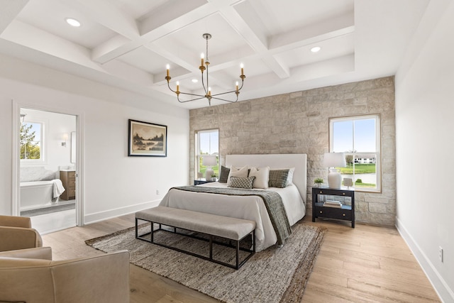 bedroom featuring an inviting chandelier, multiple windows, coffered ceiling, and baseboards