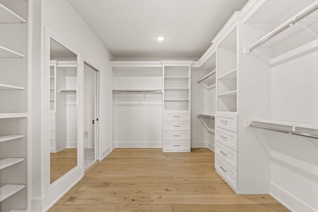 walk in closet featuring light wood-type flooring