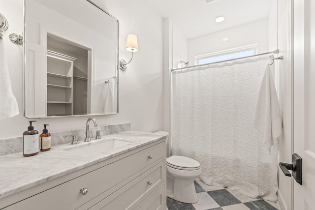 full bathroom with recessed lighting, shower / tub combo with curtain, toilet, and vanity
