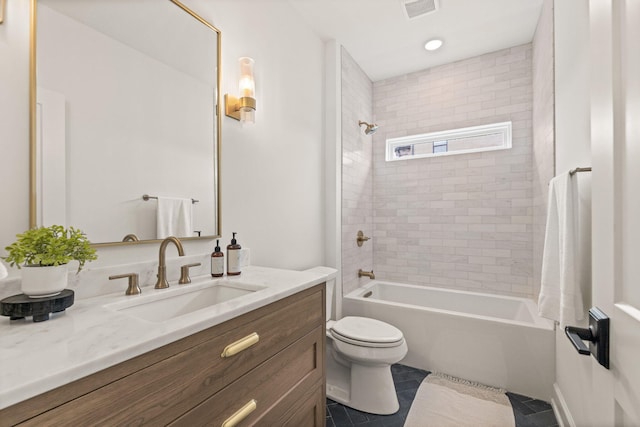 bathroom with visible vents, toilet, bathtub / shower combination, vanity, and tile patterned flooring