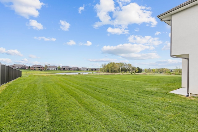 view of yard with fence and a residential view