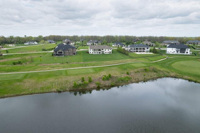 birds eye view of property with a residential view and a water view