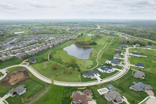 birds eye view of property with a residential view and a water view