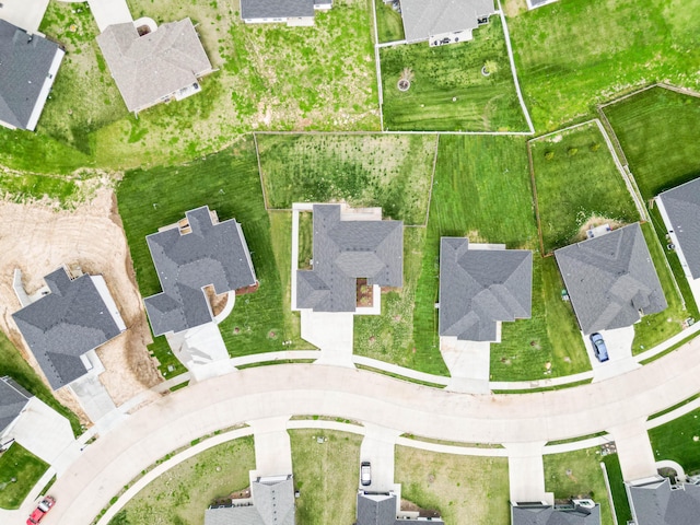 birds eye view of property with a residential view
