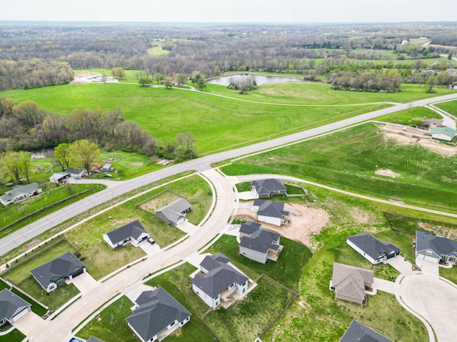 aerial view featuring a residential view and a water view