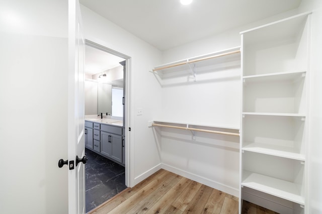 spacious closet with wood finished floors