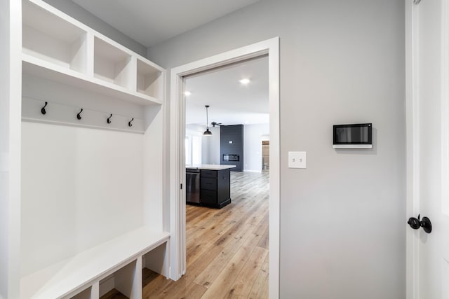 mudroom with light wood-style floors and a ceiling fan
