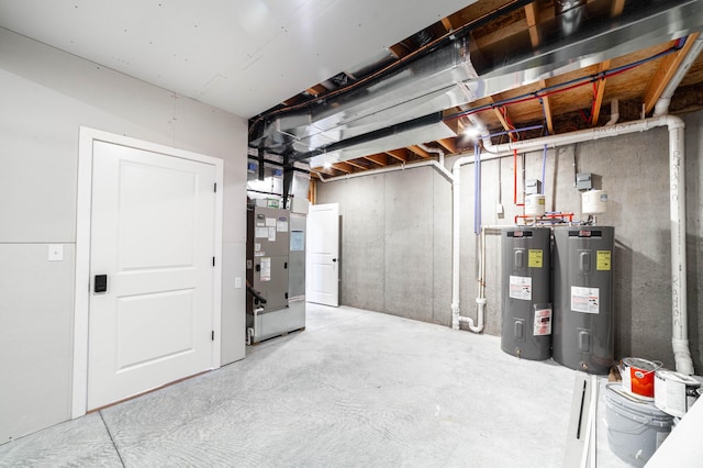 unfinished below grade area with heating unit and electric water heater