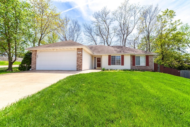 single story home with a front yard, a garage, driveway, brick siding, and fence