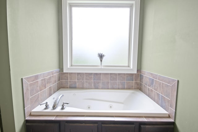 full bathroom featuring a jetted tub
