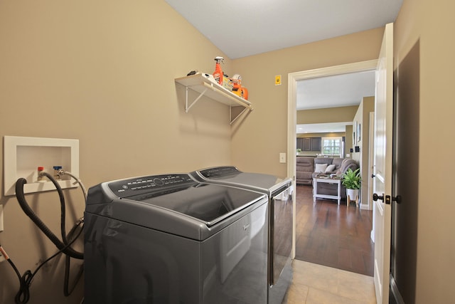 laundry room with washing machine and clothes dryer and laundry area
