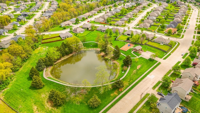 bird's eye view with a water view and a residential view