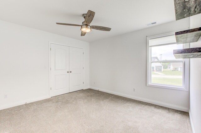 6575 Gateway Arch Way, Ashland, MO 65010 - unfurnished bedroom with carpet flooring, baseboards, a closet, and ceiling fan