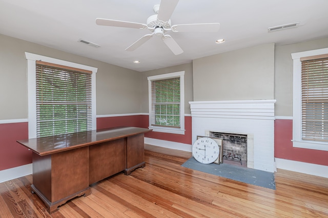 403 Westmount Ave, Columbia, MO 65203 - unfurnished office featuring wood finished floors, a brick fireplace, a ceiling fan, baseboards, and recessed lighting