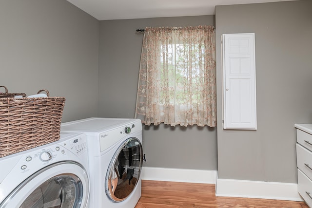 403 Westmount Ave, Columbia, MO 65203 - washroom featuring cabinet space, washer and dryer, light wood-style floors, and baseboards