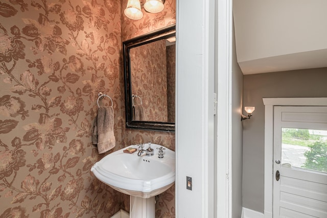 403 Westmount Ave, Columbia, MO 65203 - bathroom featuring wallpapered walls, baseboards, and a sink
