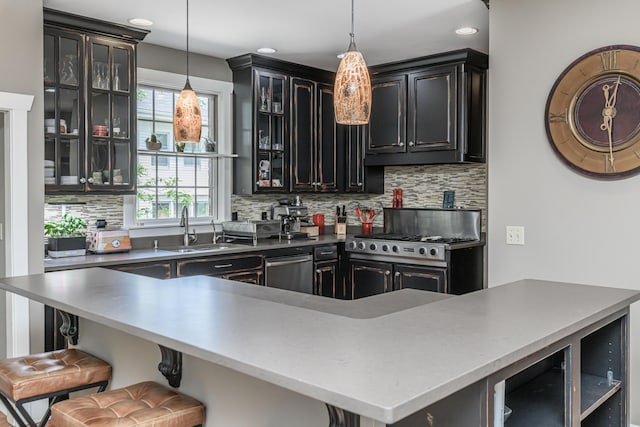 403 Westmount Ave, Columbia, MO 65203 - kitchen featuring a sink, backsplash, a breakfast bar area, beverage cooler, and pendant lighting