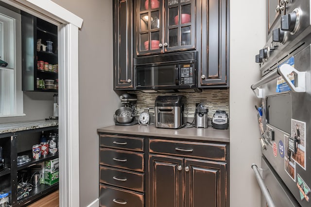 403 Westmount Ave, Columbia, MO 65203 - bar with black microwave and tasteful backsplash