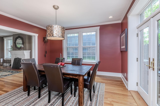 403 Westmount Ave, Columbia, MO 65203 - dining space with light wood-style flooring, baseboards, crown molding, a fireplace, and recessed lighting