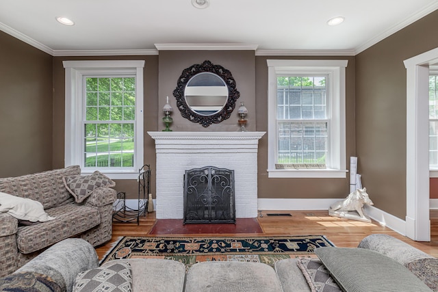 403 Westmount Ave, Columbia, MO 65203 - living area with wood finished floors, a fireplace, crown molding, baseboards, and recessed lighting