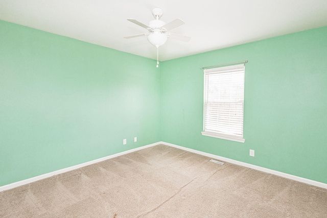 4983 N Montgomery Dr, Columbia, MO 65202 - unfurnished room with baseboards, a ceiling fan, and carpet floors