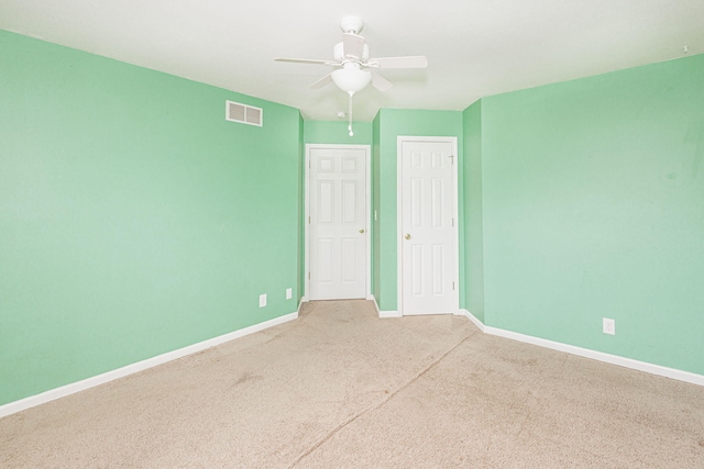 4983 N Montgomery Dr, Columbia, MO 65202 - unfurnished bedroom with a closet, baseboards, carpet, and ceiling fan