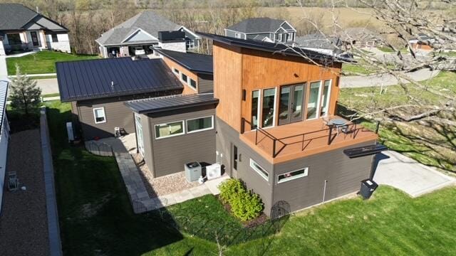 back of house with metal roof
