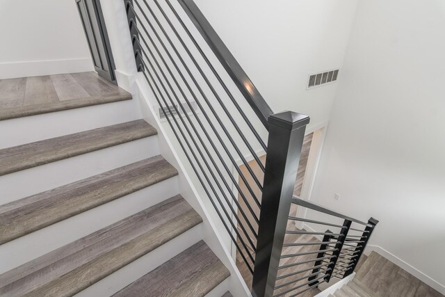 424 Angels Rest Way, Columbia, MO 65203 - staircase with wood finished floors and baseboards