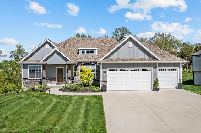 craftsman inspired home featuring a front lawn, roof with shingles, board and batten siding, an attached garage, and driveway