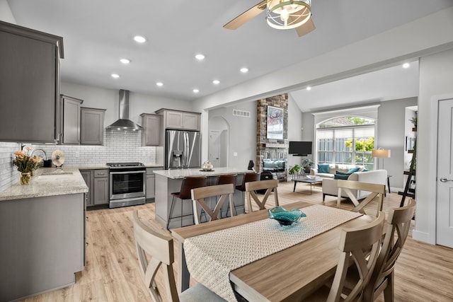 dining area with visible vents, recessed lighting, light wood-style flooring, and ceiling fan