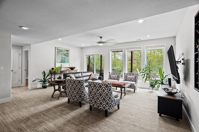 carpeted living room featuring recessed lighting, a ceiling fan, and a healthy amount of sunlight