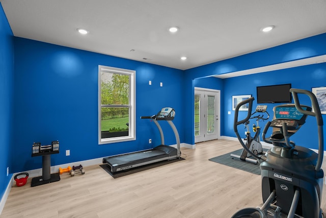 exercise room featuring recessed lighting, baseboards, and wood finished floors