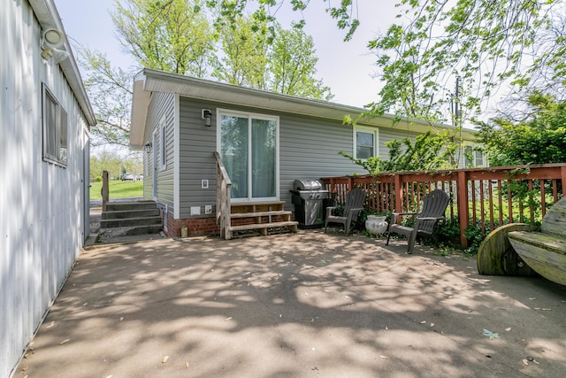 back of property with a patio area and entry steps