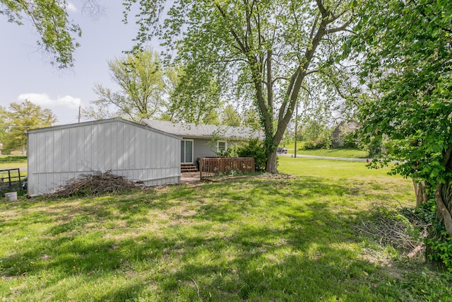 view of yard with fence and a deck