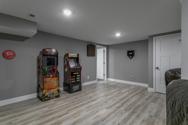 game room with light wood-style floors, recessed lighting, baseboards, and visible vents