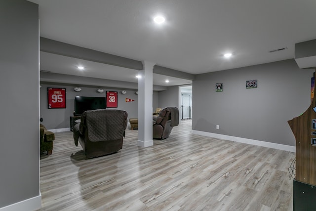 living area with recessed lighting, light wood finished floors, and baseboards