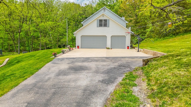 7751 W Old Barclay Creek Ln, Columbia, MO 65202 - garage with driveway and a wooded view