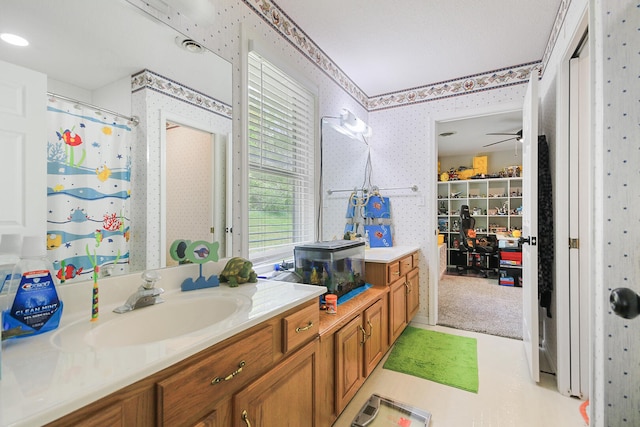 7751 W Old Barclay Creek Ln, Columbia, MO 65202 - full bath featuring wallpapered walls, vanity, and a shower with shower curtain