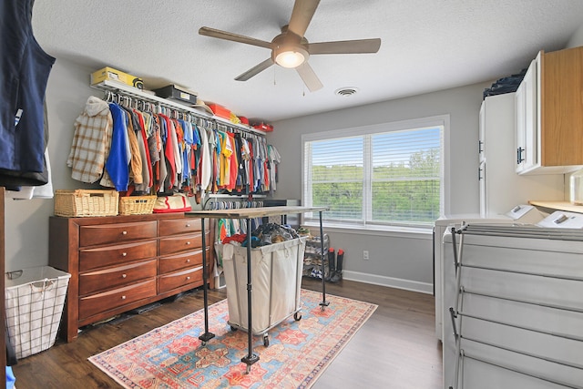 7751 W Old Barclay Creek Ln, Columbia, MO 65202 - spacious closet with washing machine and dryer, a ceiling fan, and dark wood-style flooring