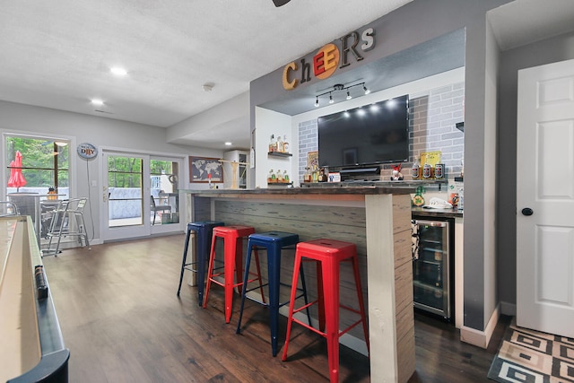 7751 W Old Barclay Creek Ln, Columbia, MO 65202 - indoor dry bar featuring wine cooler, wood finished floors, recessed lighting, and baseboards
