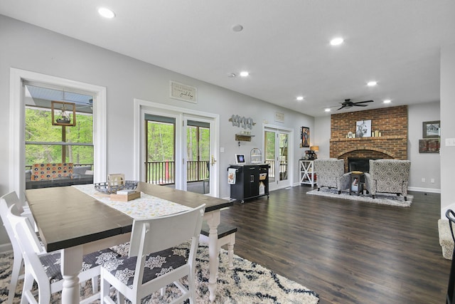 7751 W Old Barclay Creek Ln, Columbia, MO 65202 - dining room with recessed lighting, a ceiling fan, dark wood-style flooring, a fireplace, and baseboards