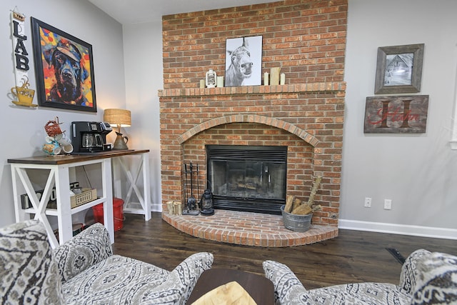 7751 W Old Barclay Creek Ln, Columbia, MO 65202 - living room with wood finished floors, baseboards, and a fireplace