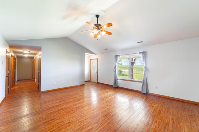 12421 Lang Rd, Boonville, MO 65233 - empty room with ceiling fan, vaulted ceiling, light wood-style flooring, and baseboards