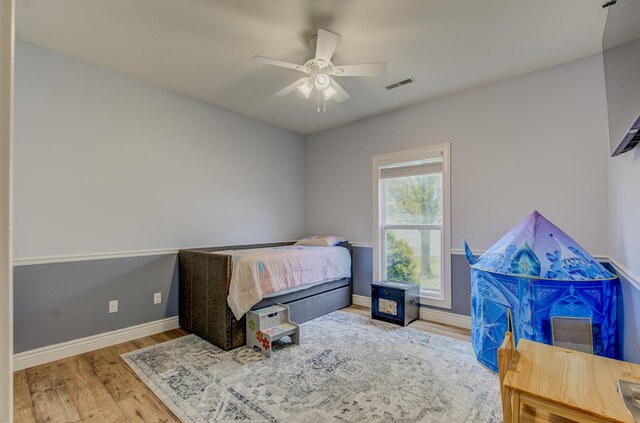 1600 Andretti Cir, Columbia, MO 65201 - bedroom featuring wood finished floors, baseboards, and a ceiling fan