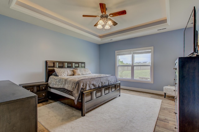 1600 Andretti Cir, Columbia, MO 65201 - bedroom with a raised ceiling, light wood finished floors, baseboards, and ceiling fan