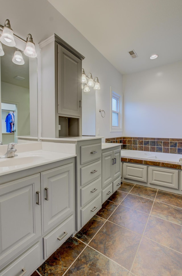 1600 Andretti Cir, Columbia, MO 65201 - full bathroom with vanity, a bath, and recessed lighting