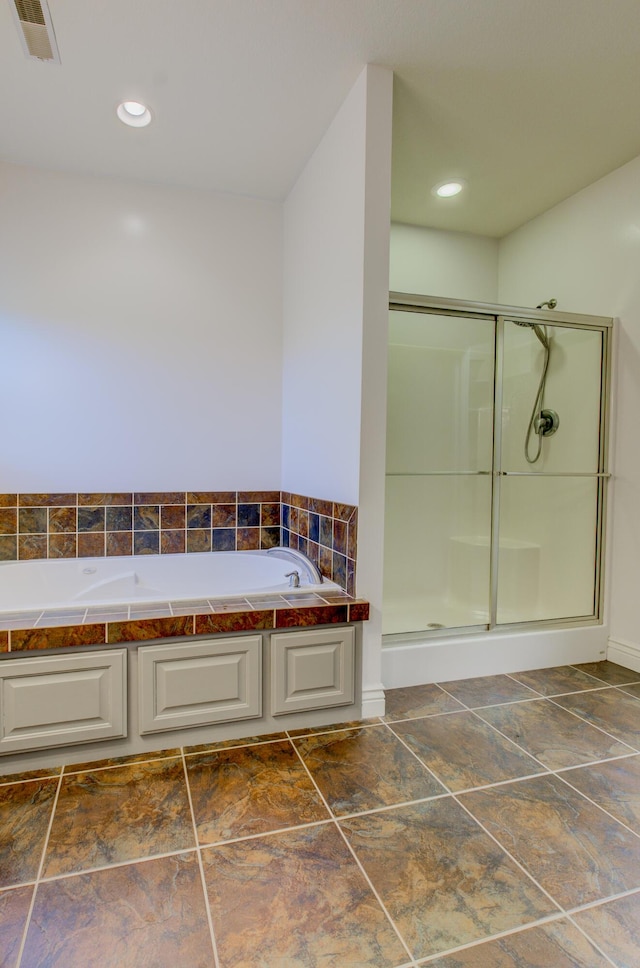 1600 Andretti Cir, Columbia, MO 65201 - bathroom featuring a stall shower, a bath, and recessed lighting